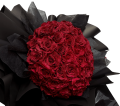 Red faux glitter rose with sparkling petals against a dark background